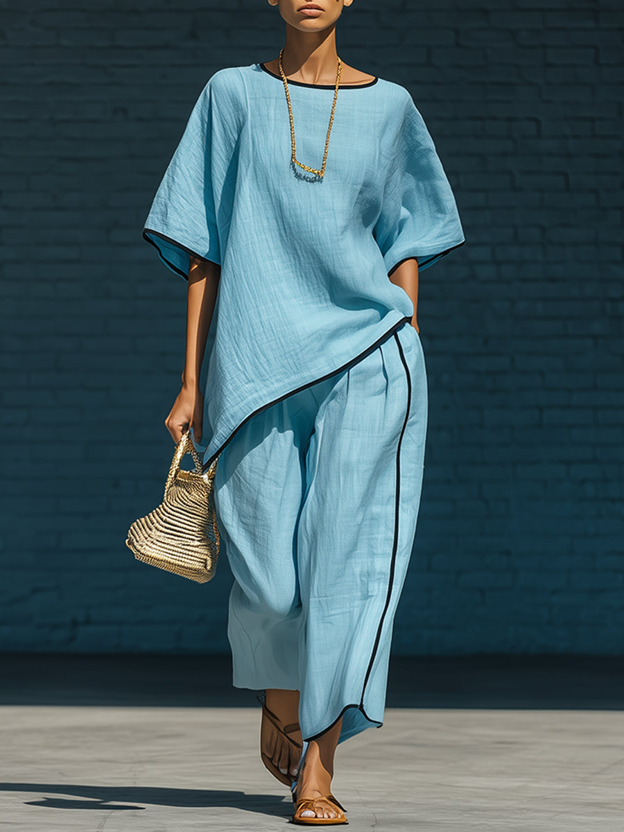 Minimalist blue irregular-hem top and wide-leg trousers set