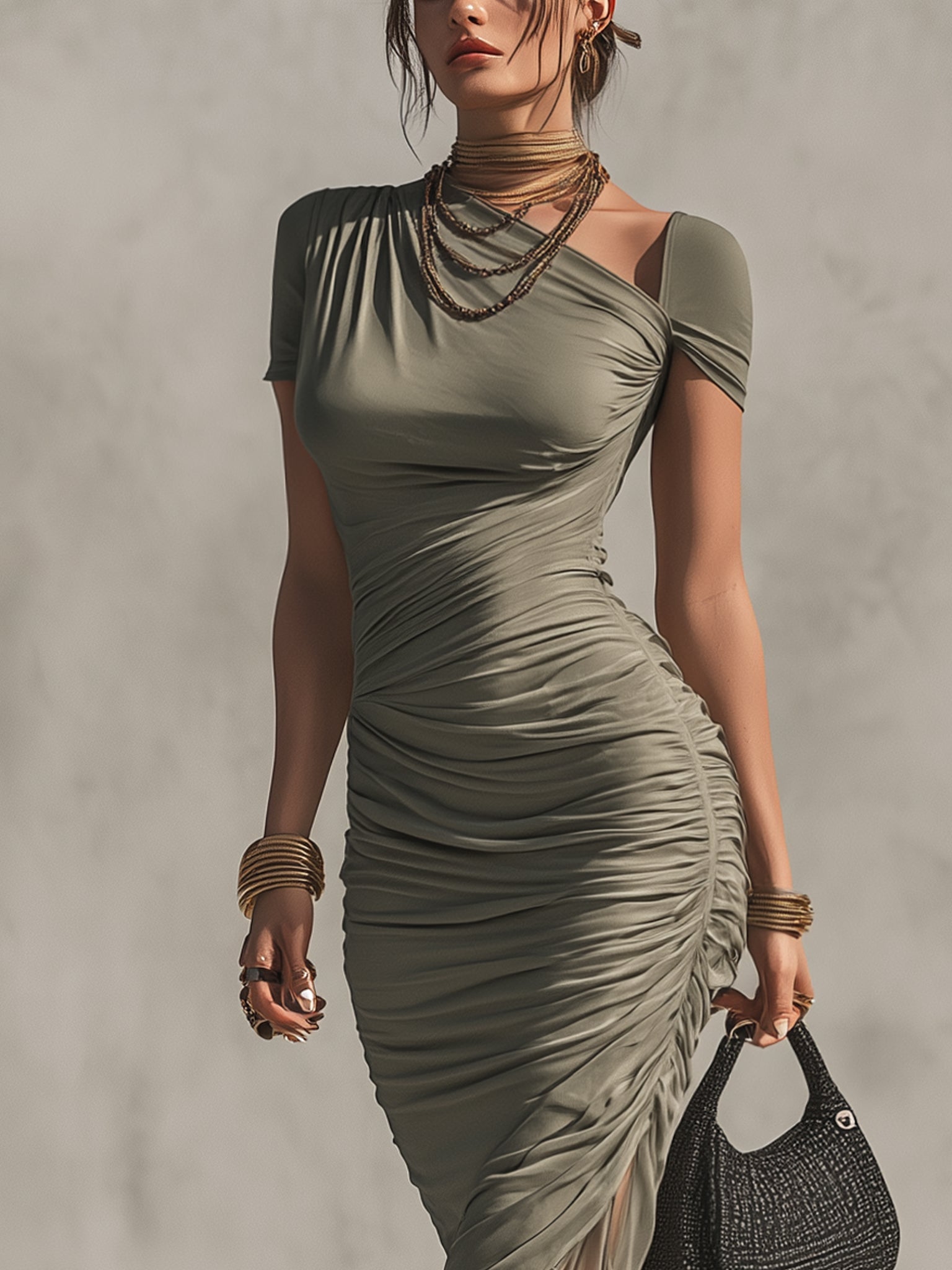 Grey irregularly shaped pleated dress with a slanted collar