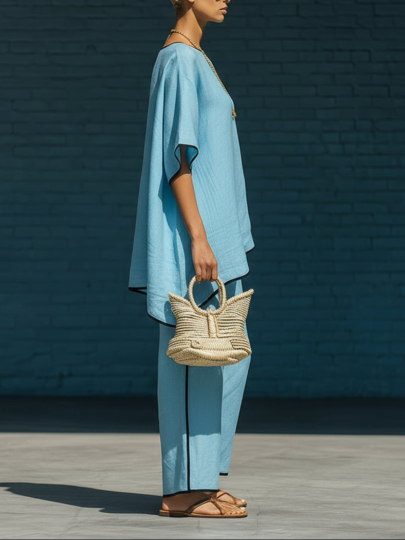 Minimalist blue irregular-hem top and wide-leg trousers set