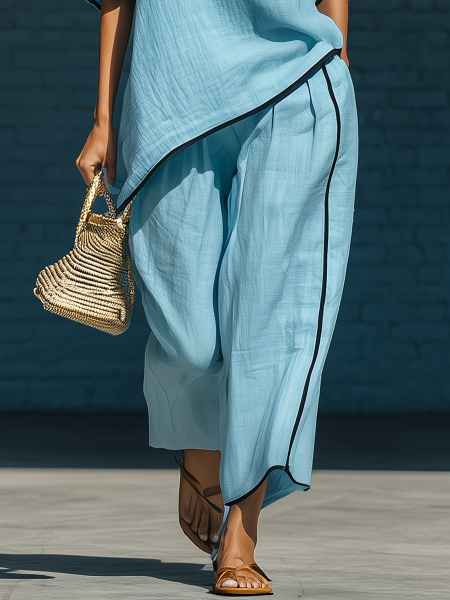 Minimalist blue irregular-hem top and wide-leg trousers set